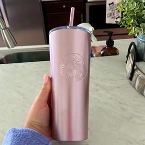 Starbucks cup, used a few times but sat in the cabinet most of the time.